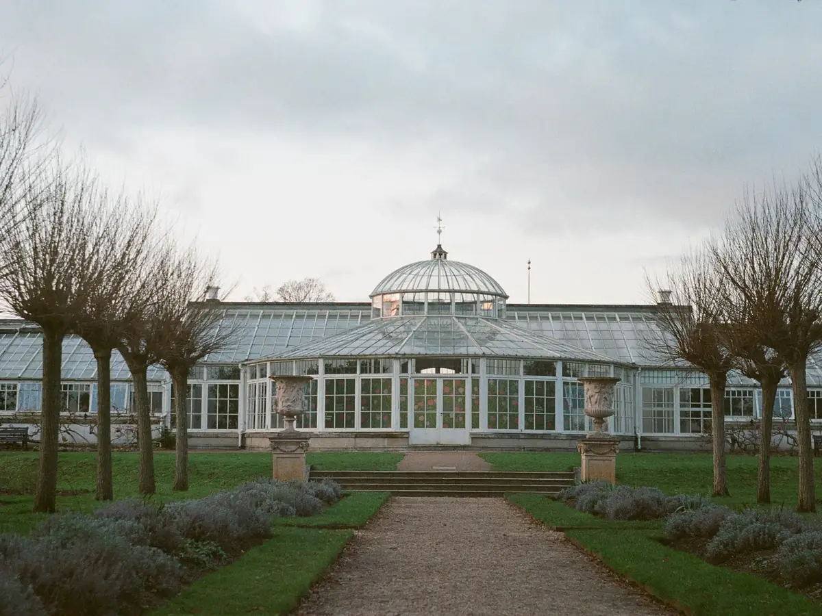 Victorian-style glasshouse in a garden