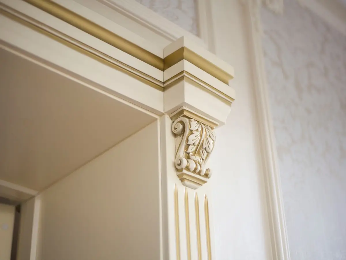 Classical plaster cornice and capital detail in a period interior