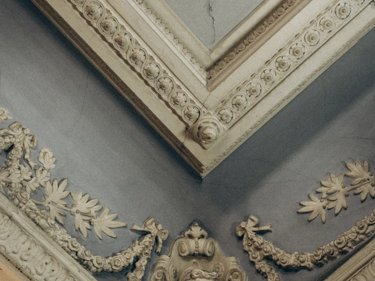 Ornate corner of a period cornice with layered decorative bands