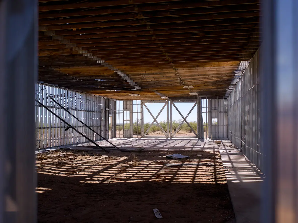 Lightweight metal stud framing inside an open interior