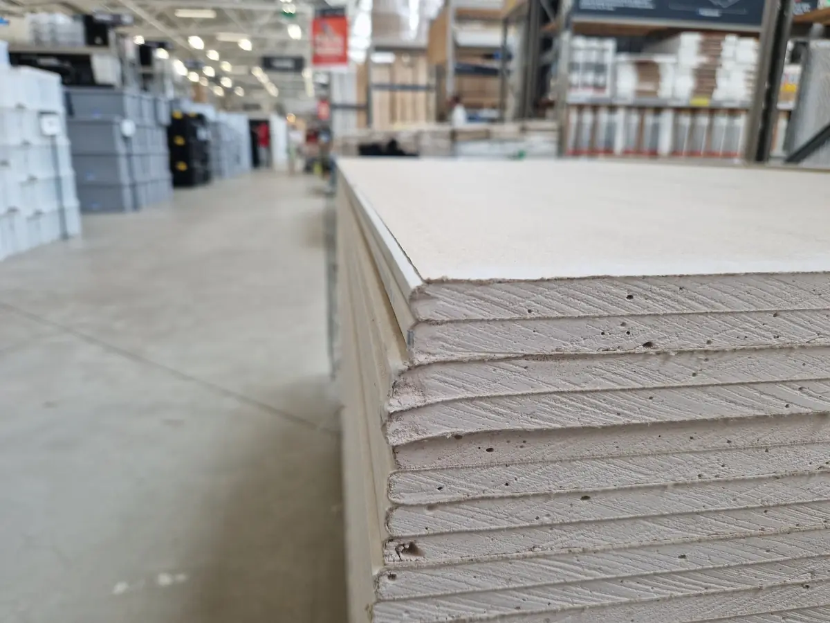Plasterboard sheets stacked ready for a drylining job