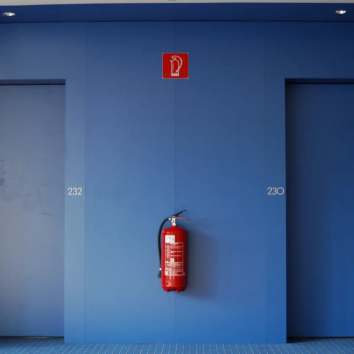 Fire doors and extinguisher in a corridor