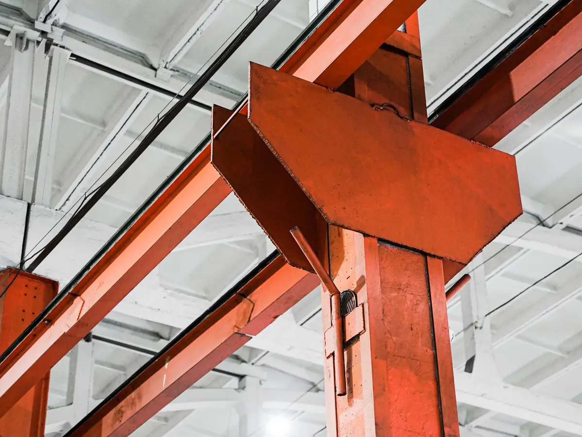 Painted structural steel beams and columns inside a building