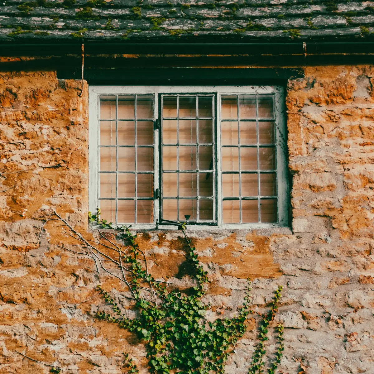 Rubble stone wall with a small window