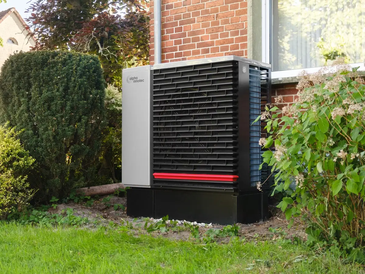 Heat pump unit on a stand in a garden