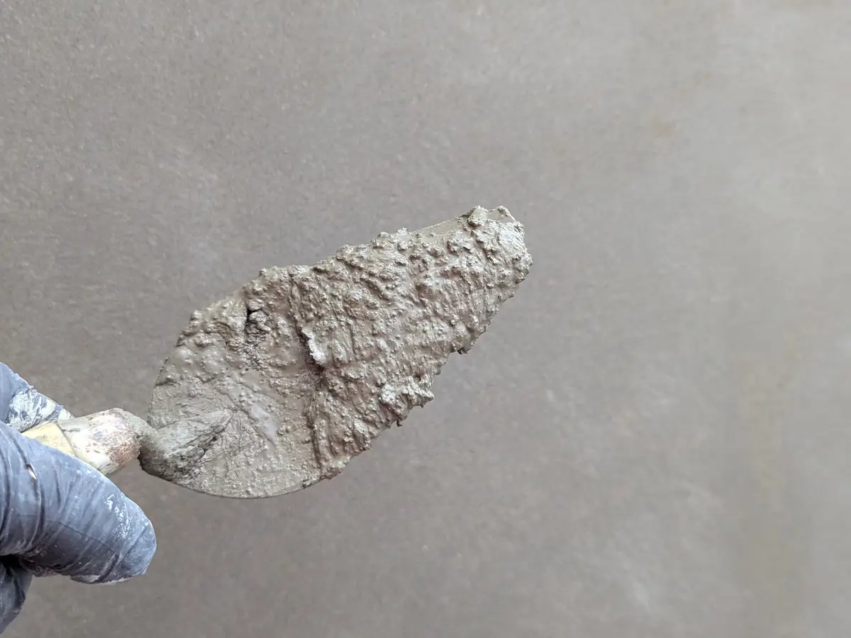 Trowel of finishing plaster ready for a ceiling skim