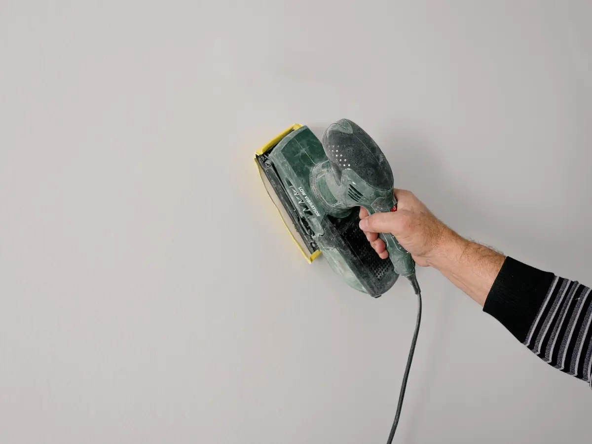 Sanding back a filled repair before the final coat