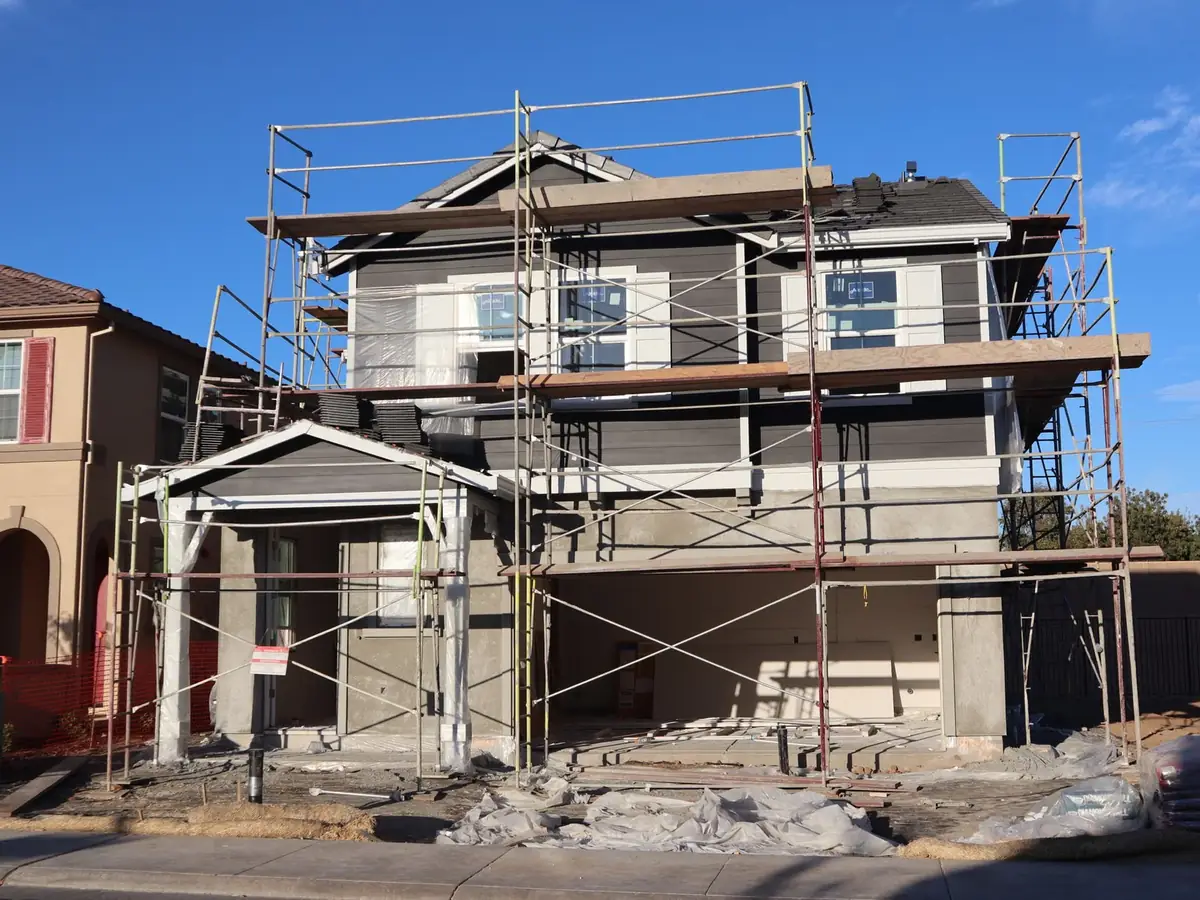 House under scaffolding ready for rendering