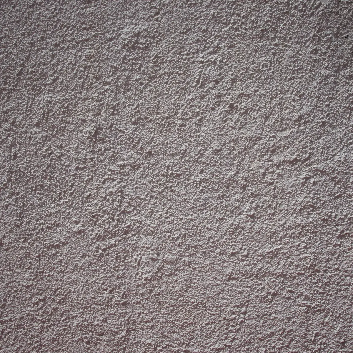 Dark scraped render finish