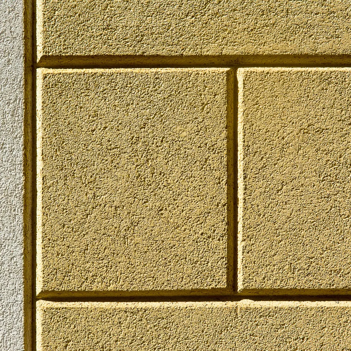 Painted cement render with ashlar lines