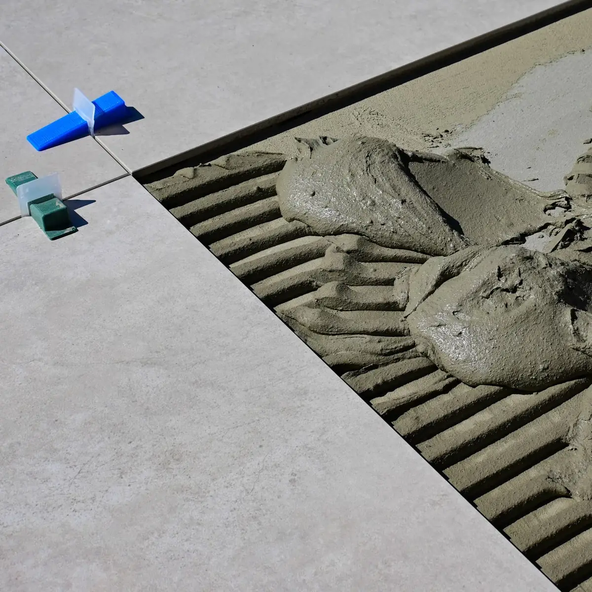Spacers and adhesive on a prepared floor