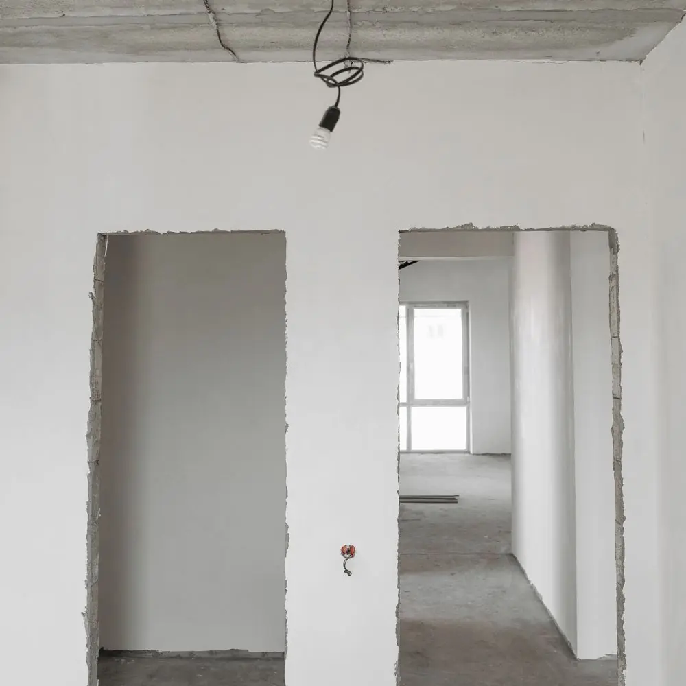 Newly boarded and plastered rooms awaiting decoration
