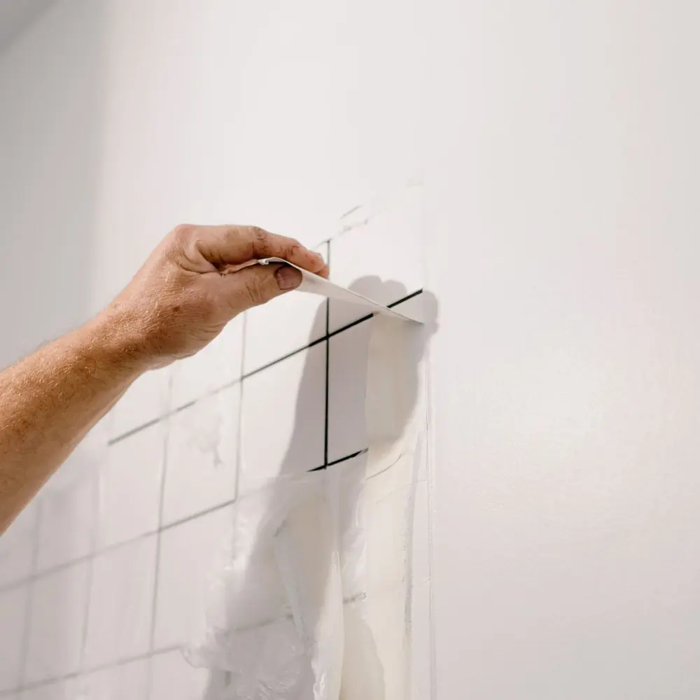 Marking out insulation boards on a wall before fixing