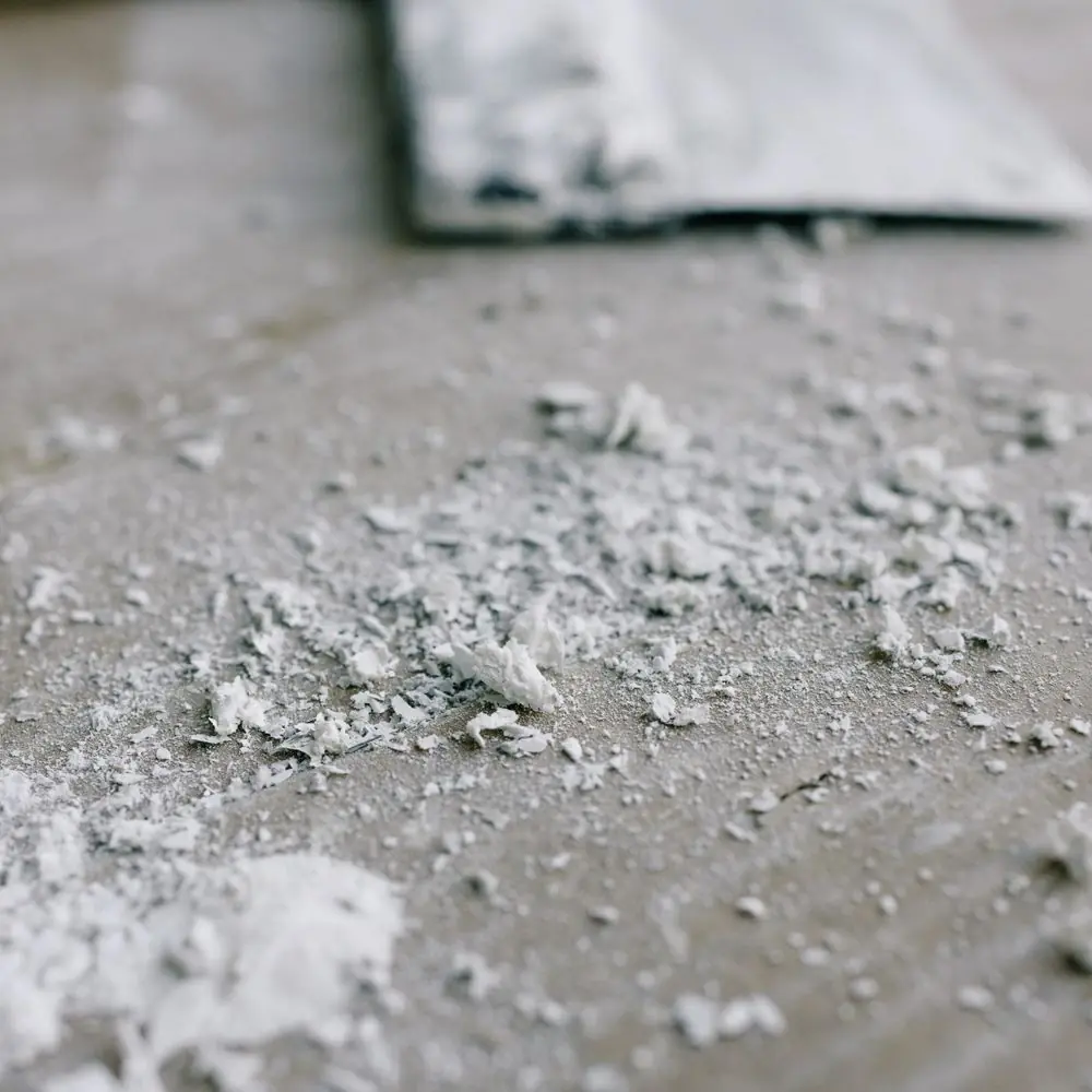 Screed and plaster residue on a floor mid-job