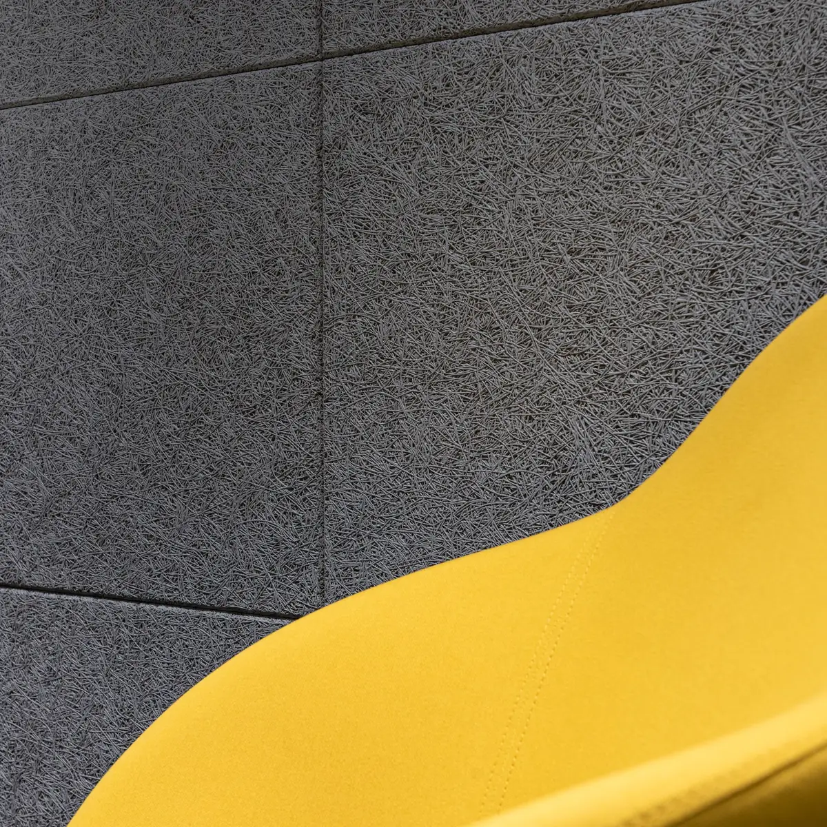 Chair against an acoustic wall