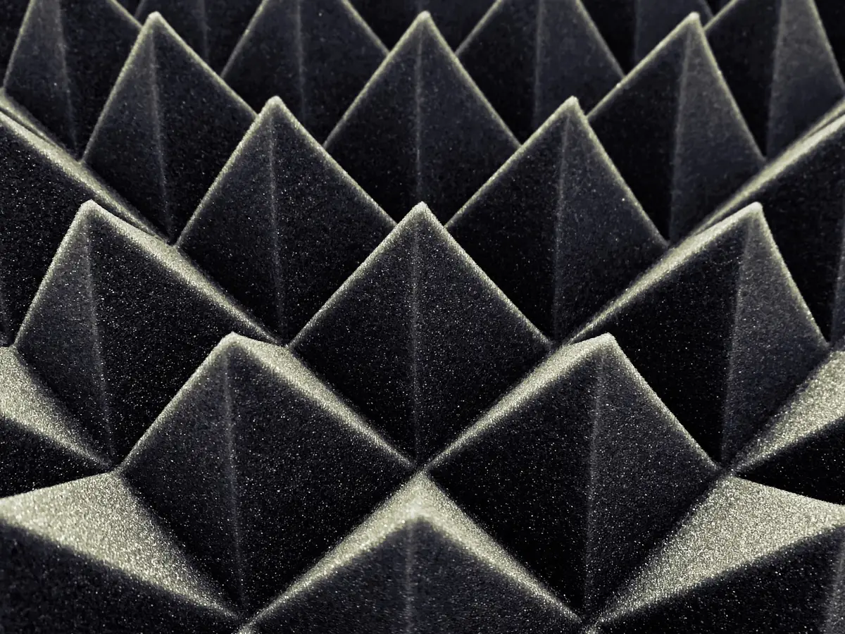 Black pyramid acoustic foam panels in a grid