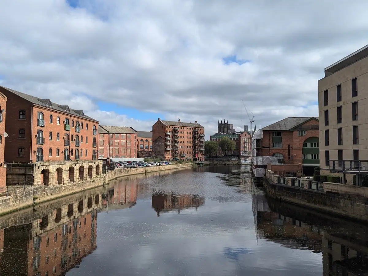 Leeds waterfront with converted warehouses along the river