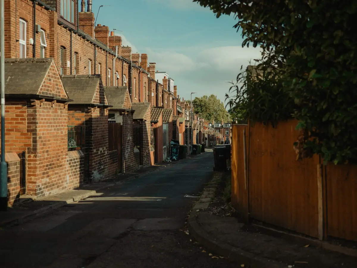 Brick terraced houses on a quiet Leeds street