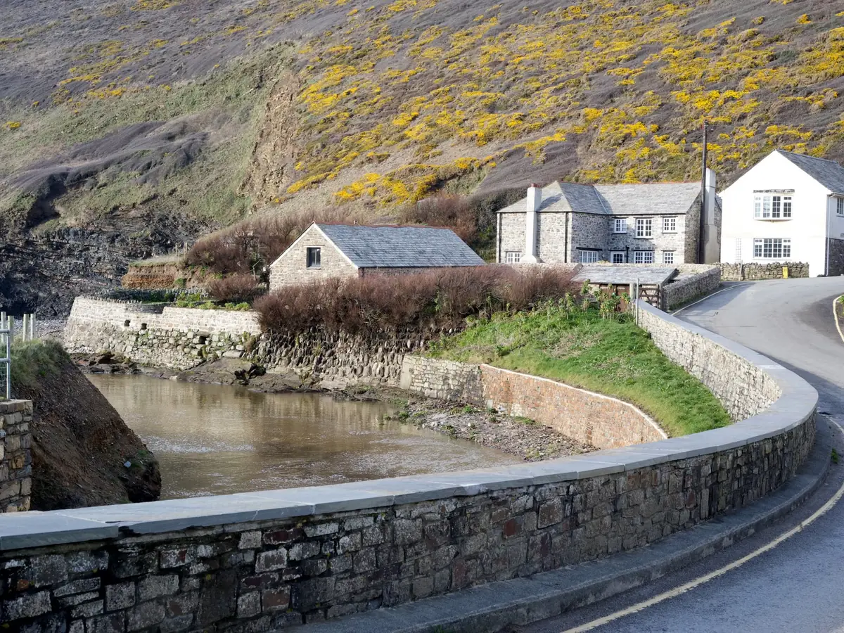 Stone houses along a winding road in a Yorkshire village