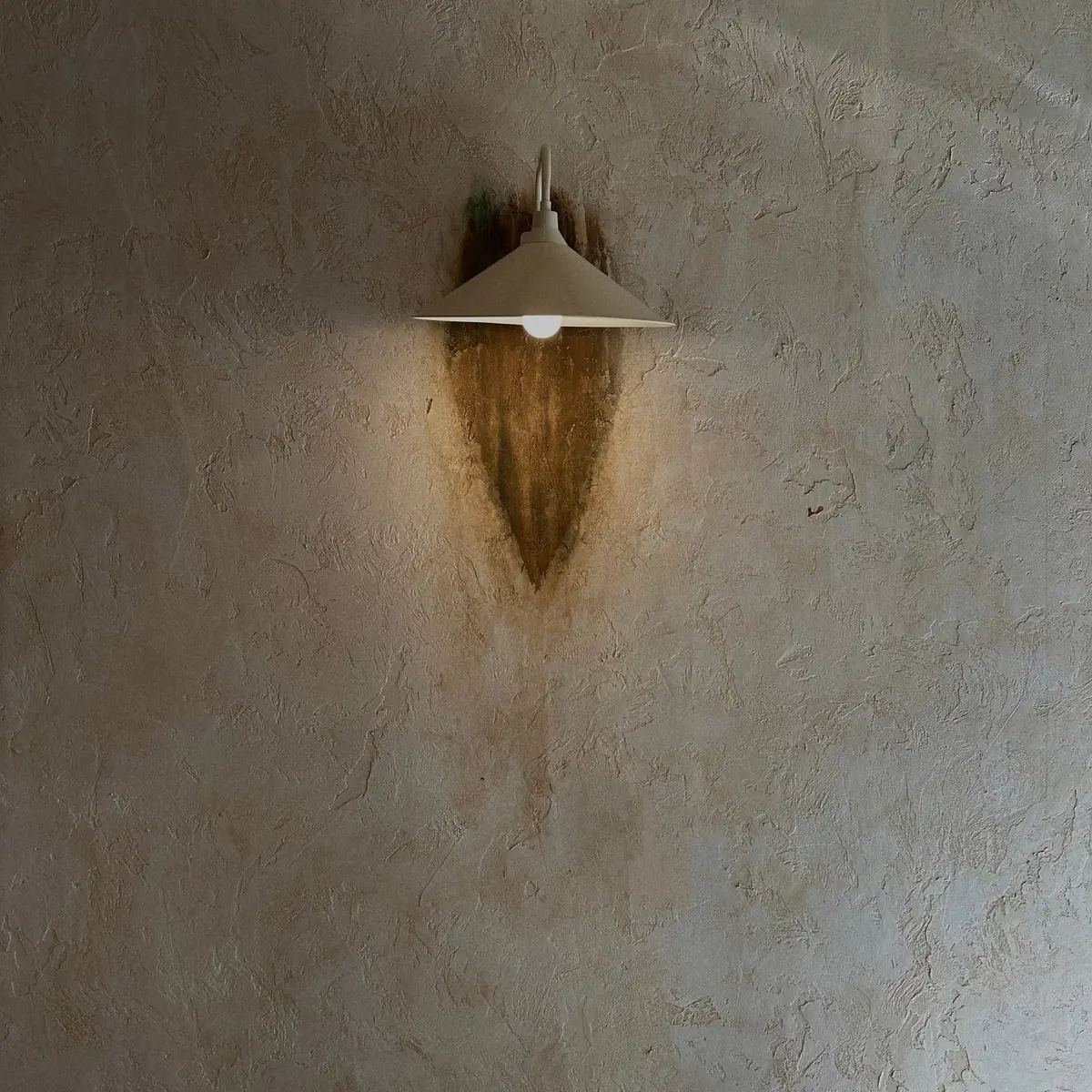 Wall lamp on textured plaster