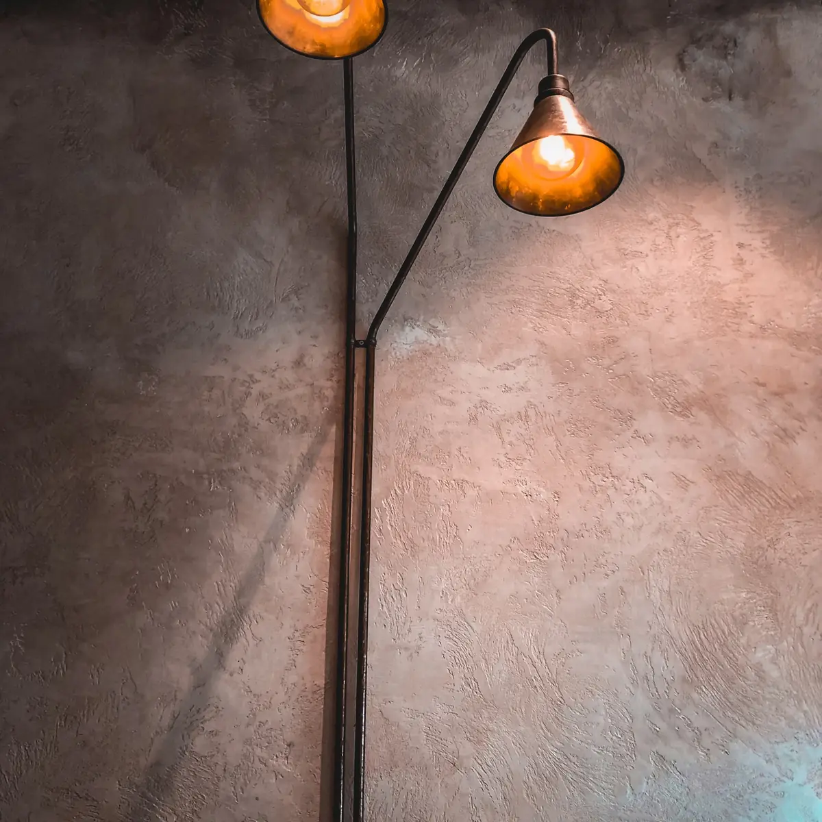 Warm light on a mottled plaster wall